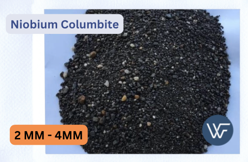 Granules of niobium columbite in sizes ranging from 2MM to 4MM displayed on a flat surface.