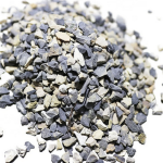 A pile of small, irregularly shaped granules of bauxite ore in various shades of gray and beige.